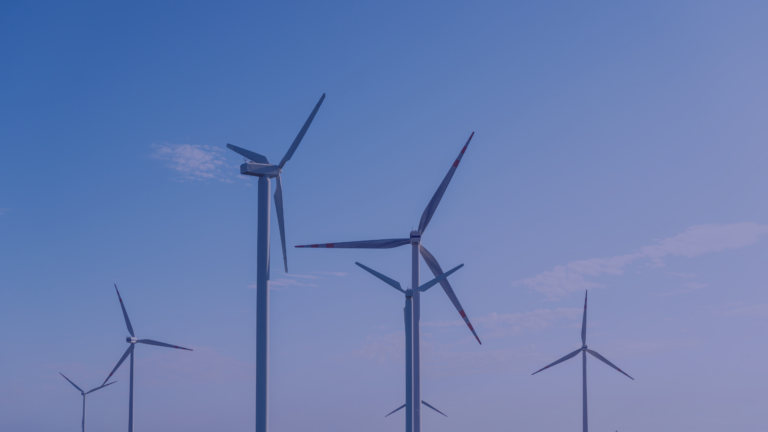 a graphic of wind turbines against a clear blue sky.