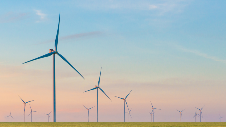 Windmills against a blue sky.